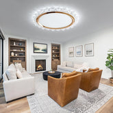 Modern living room with a fireplace, bookshelves, and comfortable seating.